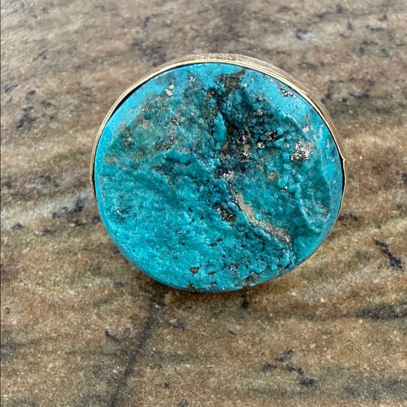 Jes MaHarry one of a kind ring with a rough unpolished turquoise in gold bezel.